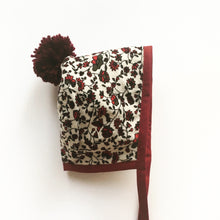 Load image into Gallery viewer, Festive Floral Winter Bonnet with Burgundy Binding with matching Pom Pom
