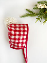 Load image into Gallery viewer, Christmas Gingham Woollen Bonnet with Red Binding and Cream Pom Pom

